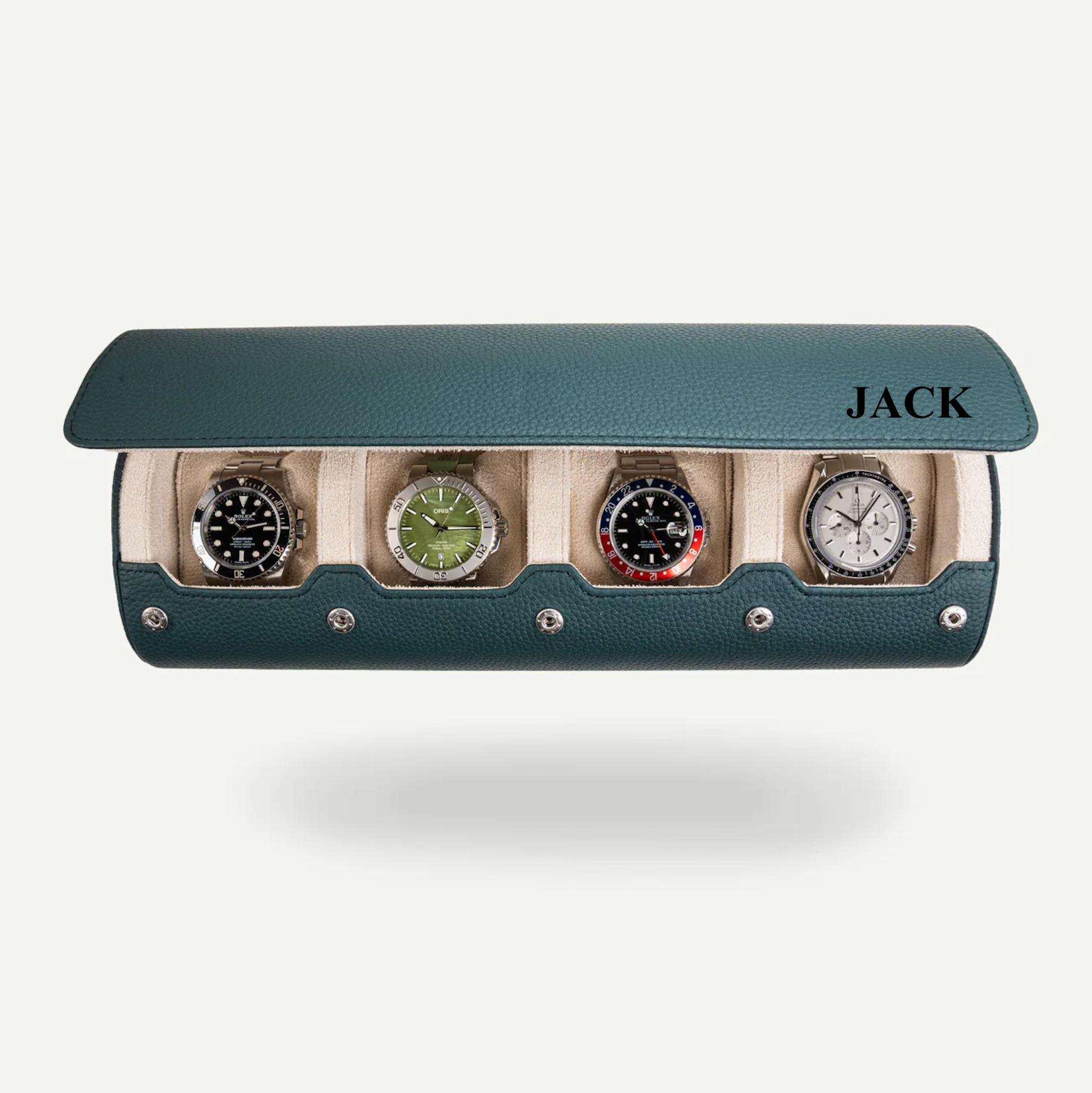 A dark green litchi-patterned leather watch roll open, displaying four compartments with watches in each, and the name 'JACK' engraved on the top.