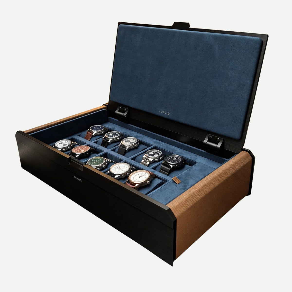 Open AUBLIQ black and brown 10-slot watch box with ten watches, blue lining and a covered strap compartment.