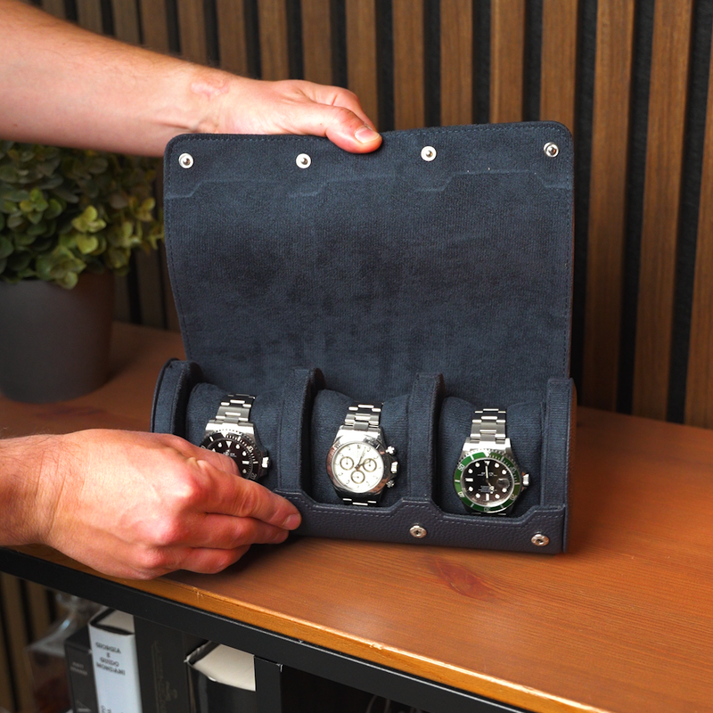 Watches beautifully displayed in navy blue watch roll